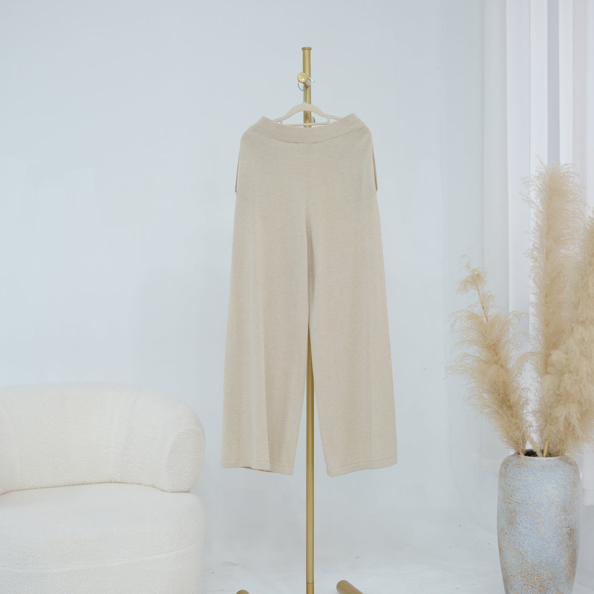 Lifestyle shot of jersey knit set layered with cardigan