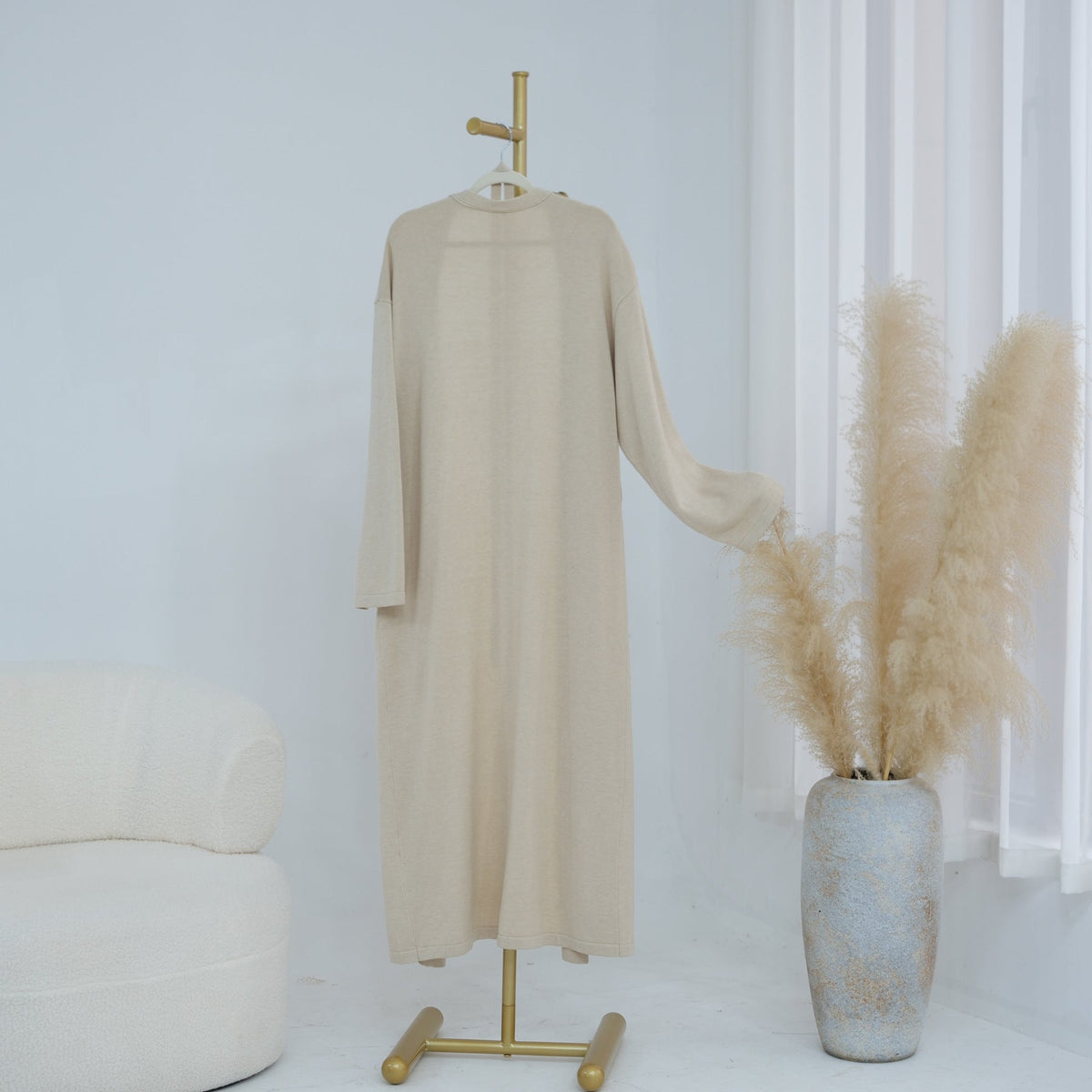 Full-length view of coordinating knit outfit