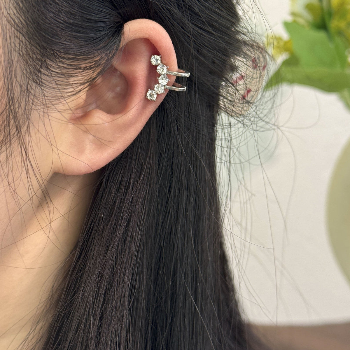 Model wearing constellation ear crawler with hijab styling