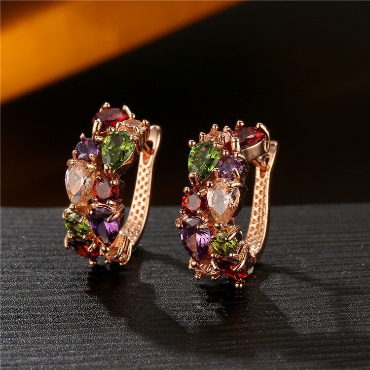 Pair of sparkling ear crawler studs laid side by side