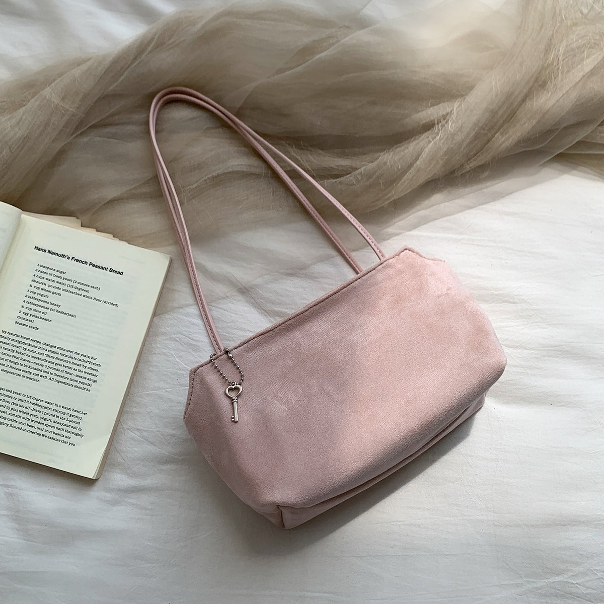 Underarm carry view of soft-touch vintage shoulder bag