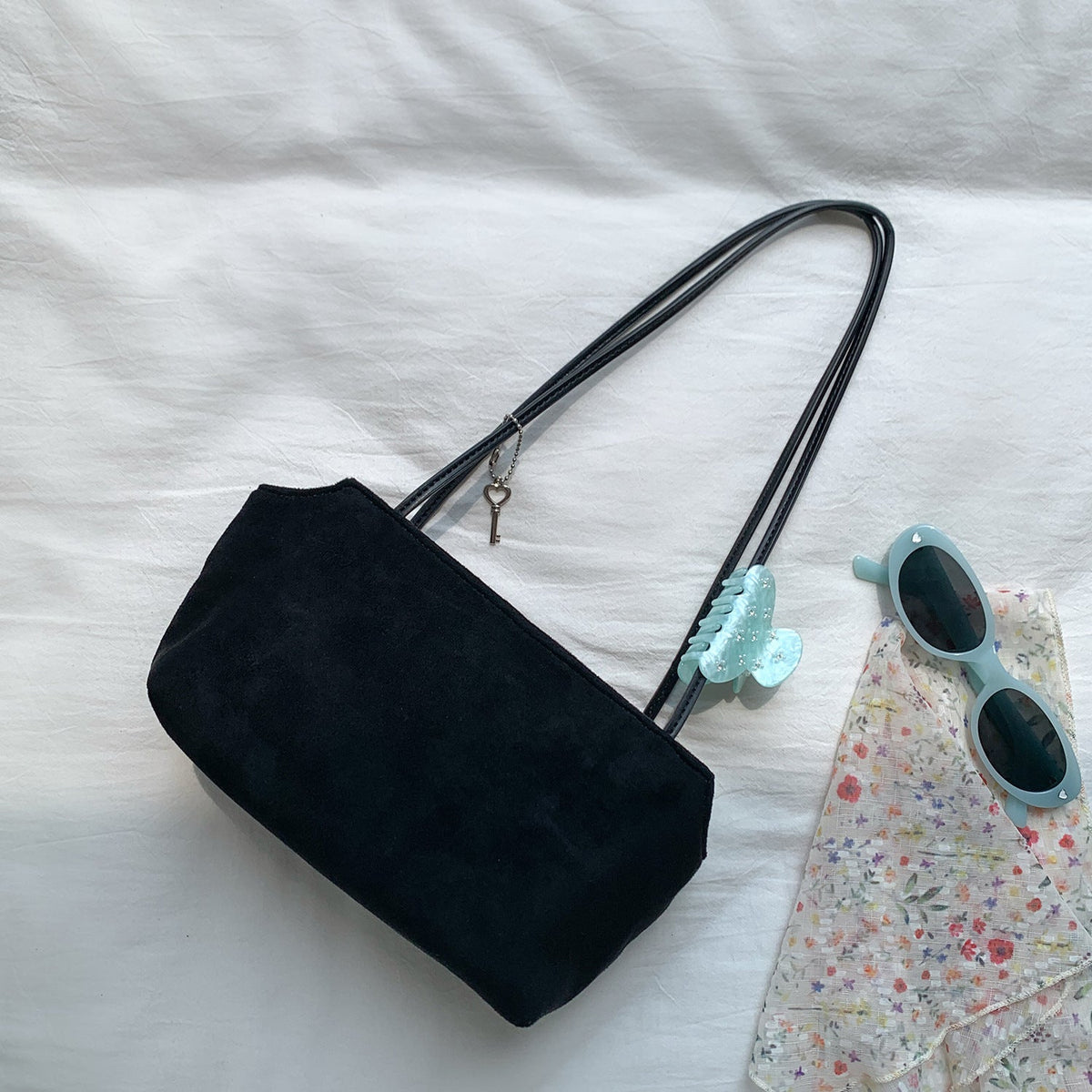 Interior layout showing main compartment and zip pocket of petite shoulder bag
