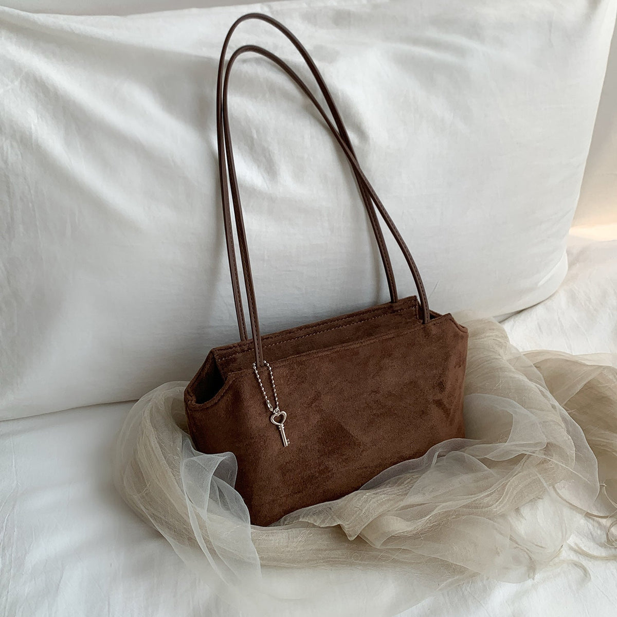 Close-up of rich suede texture finish on compact purse
