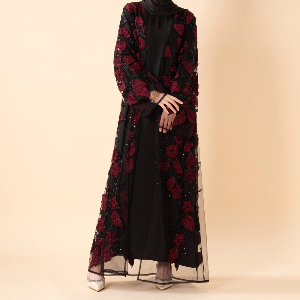 Close-up of sculpted 3D floral embroidery and beadwork on luxury open abaya