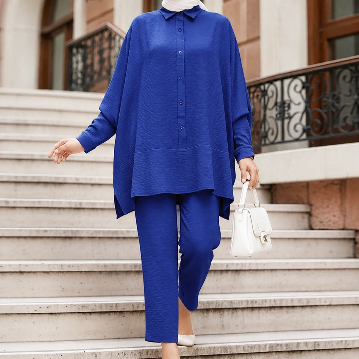 Curved side vent and asymmetric hem detail on the crinkle batwing shirt
