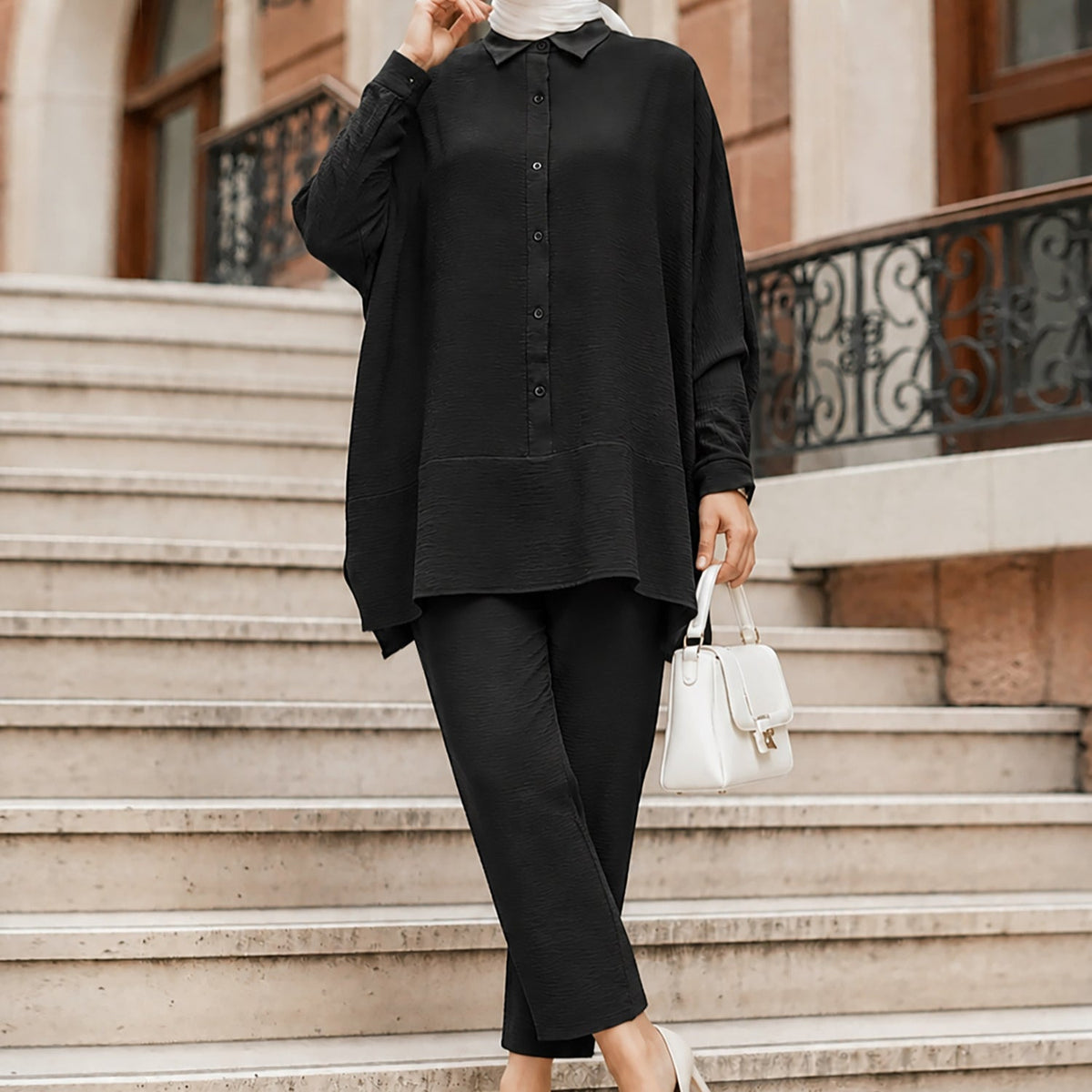 Front view of textured crinkle batwing shirt with button-down placket and rolled cuffs