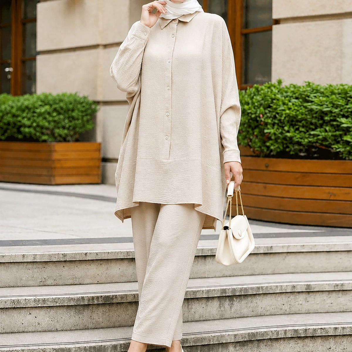 Side view of straight-leg cropped trousers with elasticated waist in crinkle fabric