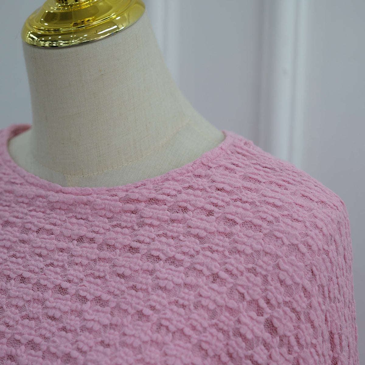 Wide sweeping batwing arc from shoulder on the cape-sleeve dress