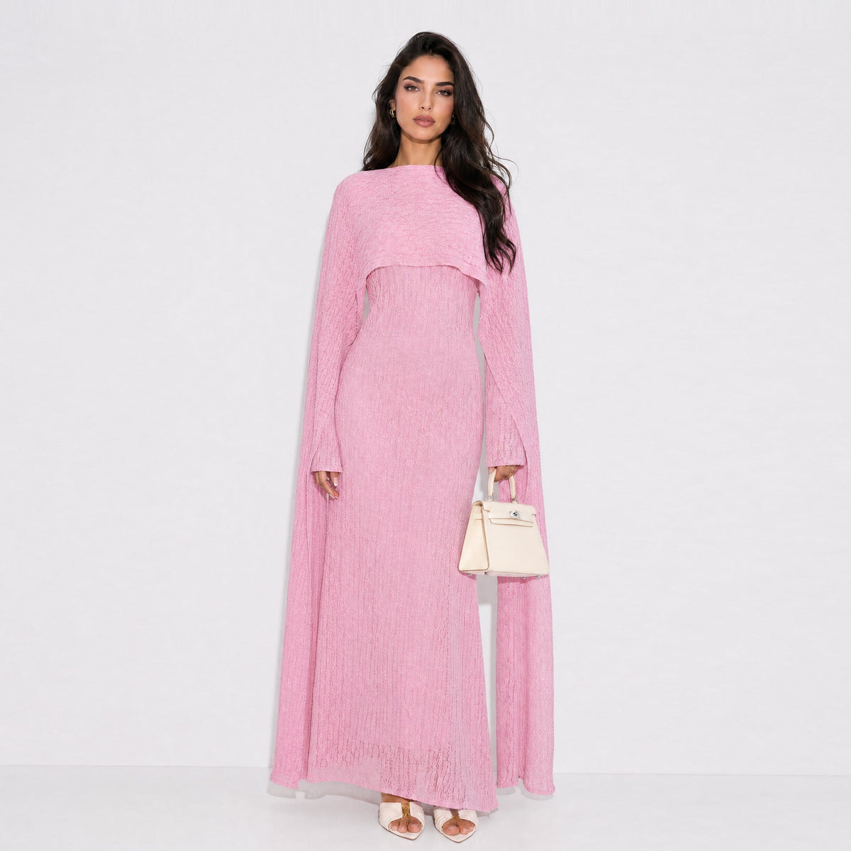 Side view of cape sleeve drape over the hips