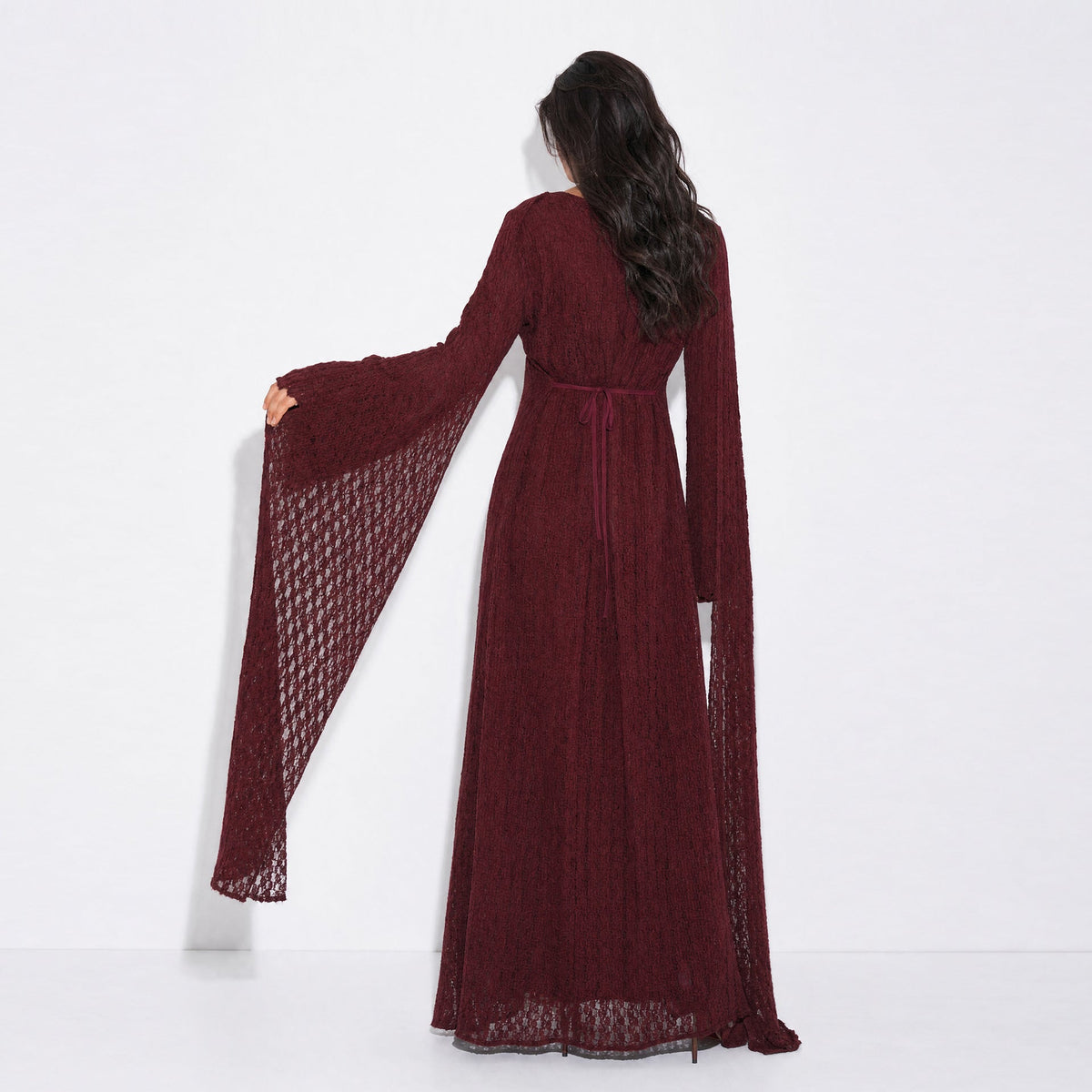 Cape hem layering over hips on the floral lace modest dress