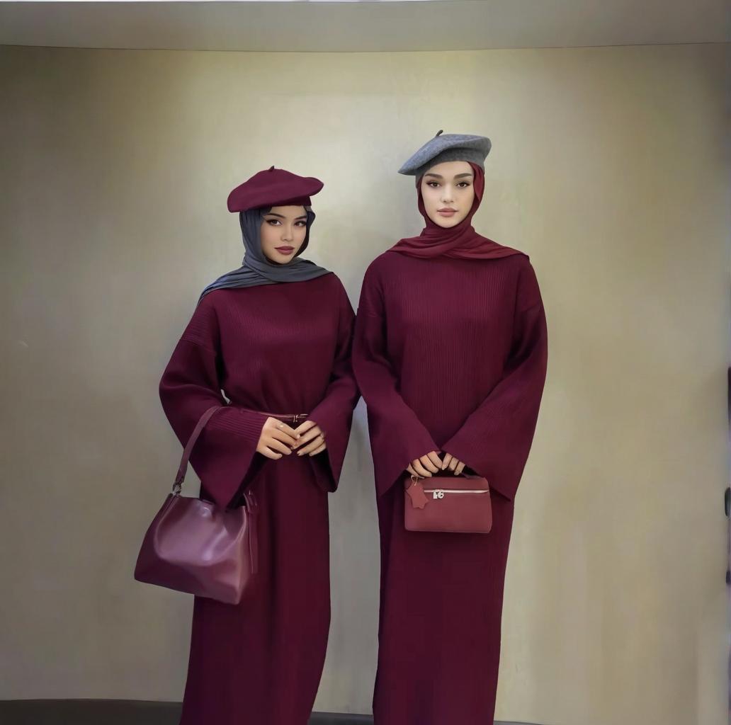 Layered styling of modest knit maxi dress with long coat and scarf