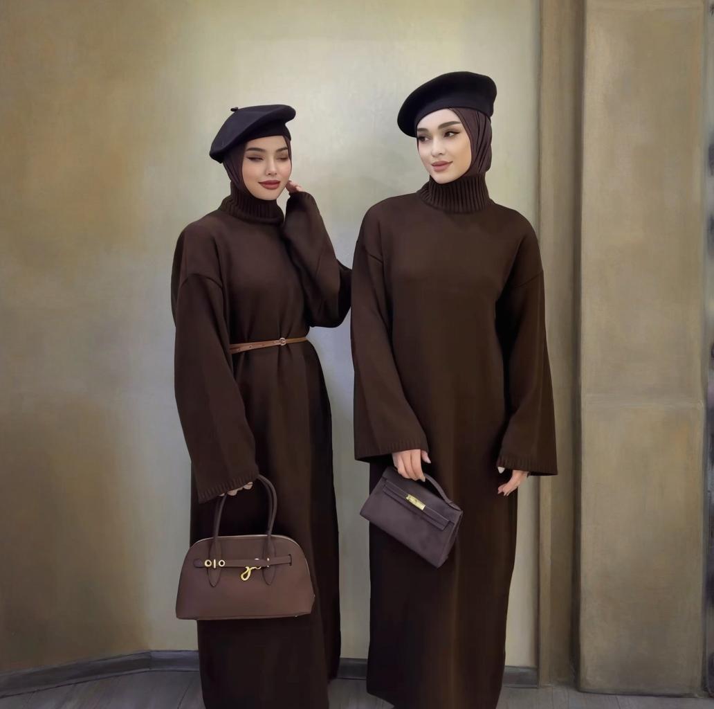 Full-length view of wide sleeves and ribbed cuffs on winter knit maxi dress