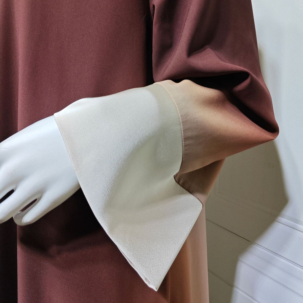 Front open silhouette of colour-block abaya with clean bound edge