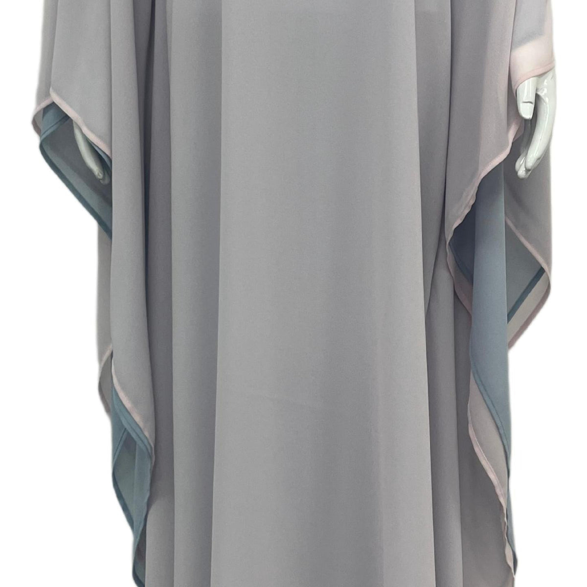 Arms extended view showing full triangular batwing sweep of two-tone maxi abaya