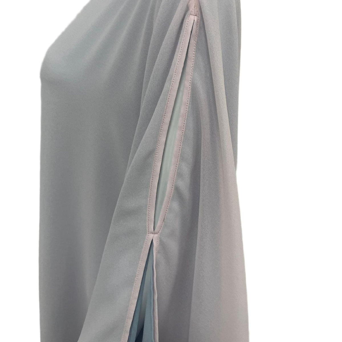 Close-up of wrist slit detail with ice blue lining on butterfly abaya sleeve