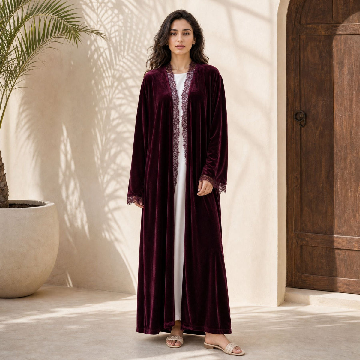 Close-up of delicate lace-panel detailing on velvet-look open abaya