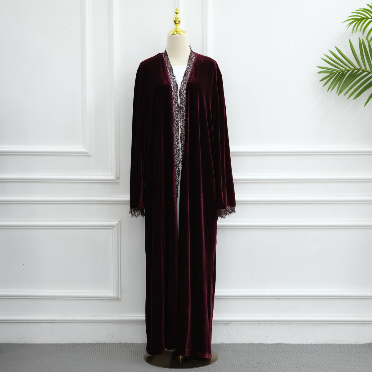 Velvet abaya draped open showing inner dress coordination