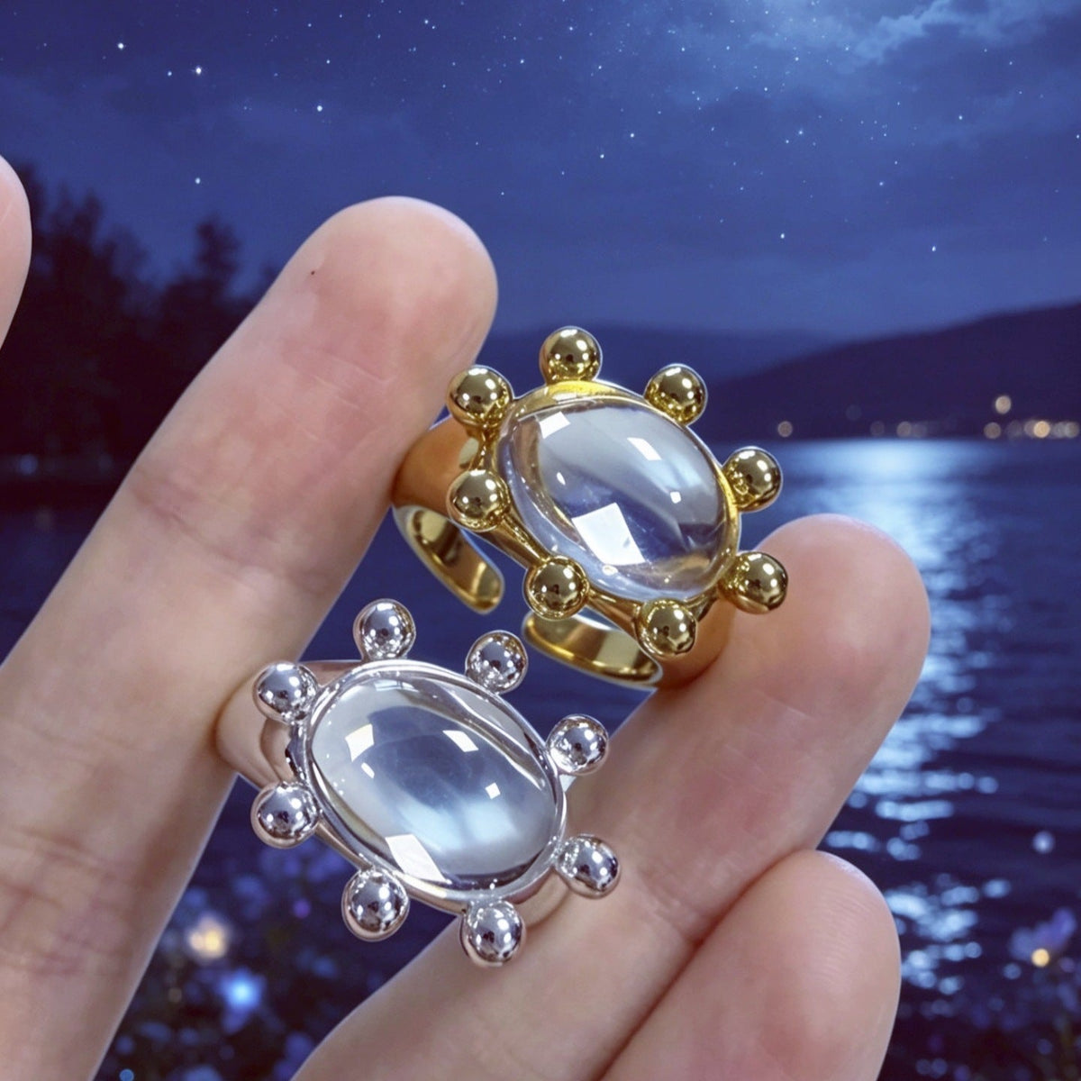 Overhead flat-lay of warm and cool tone vintage sunburst rings side by side