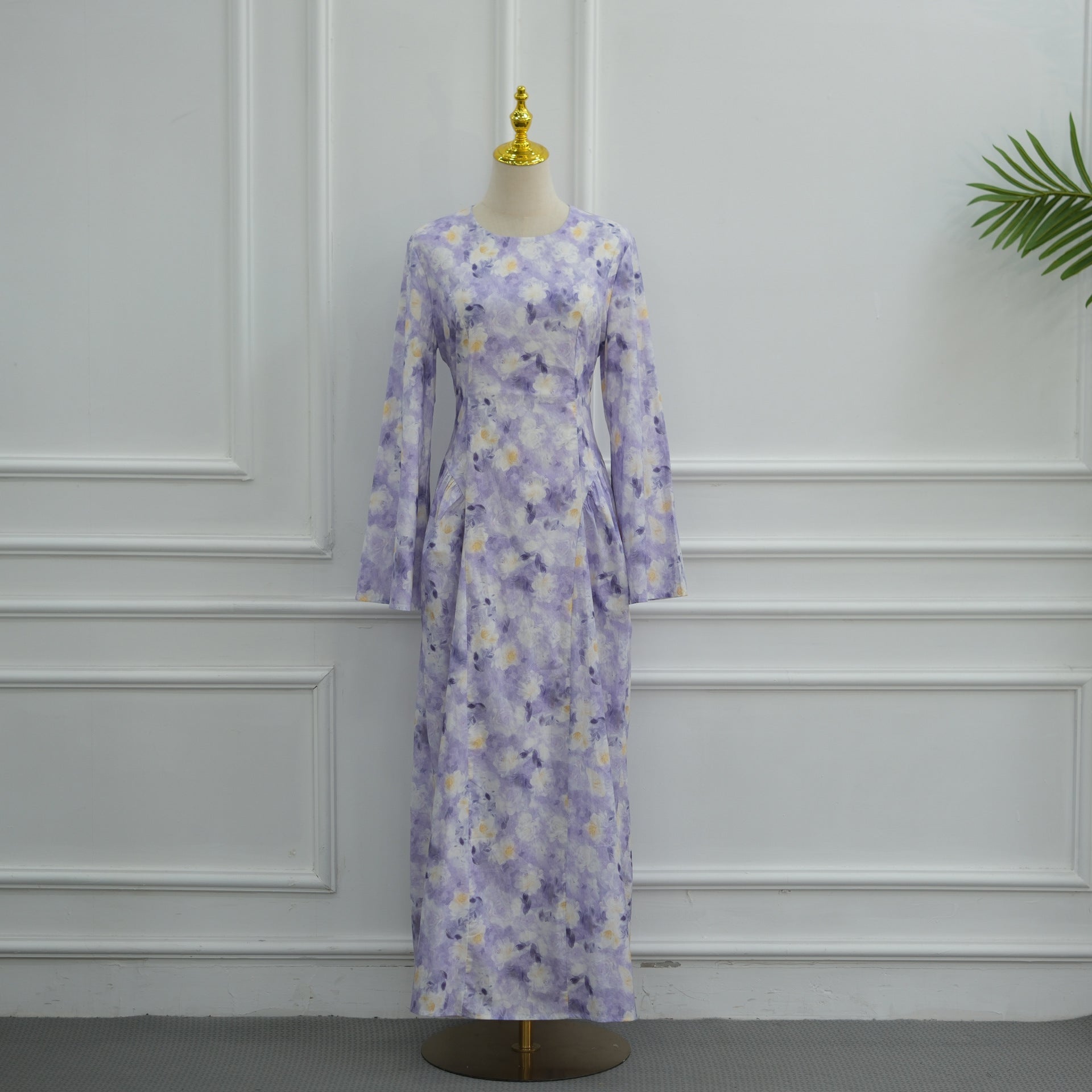 Full-length side profile of flared bell sleeve modest floral print dress