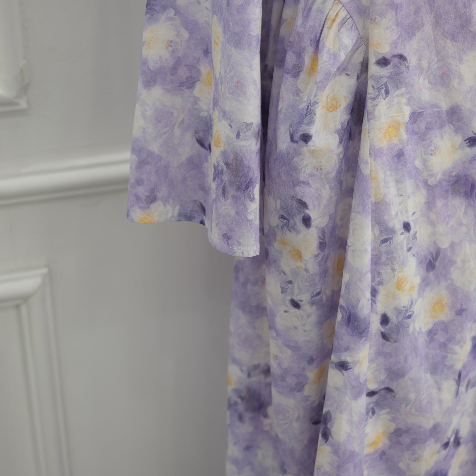 Close-up of large layered blooms on watercolour floral print fabric