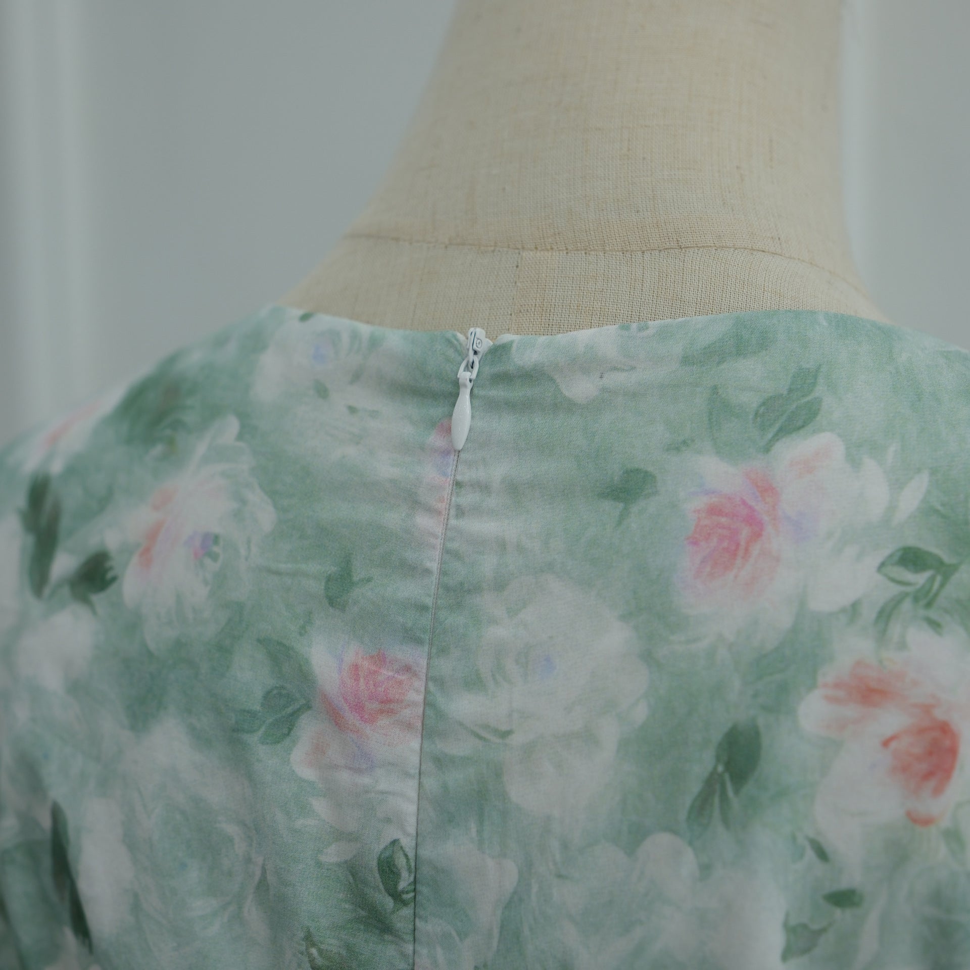 Draped skirt hem detail of floor-length modest floral print dress