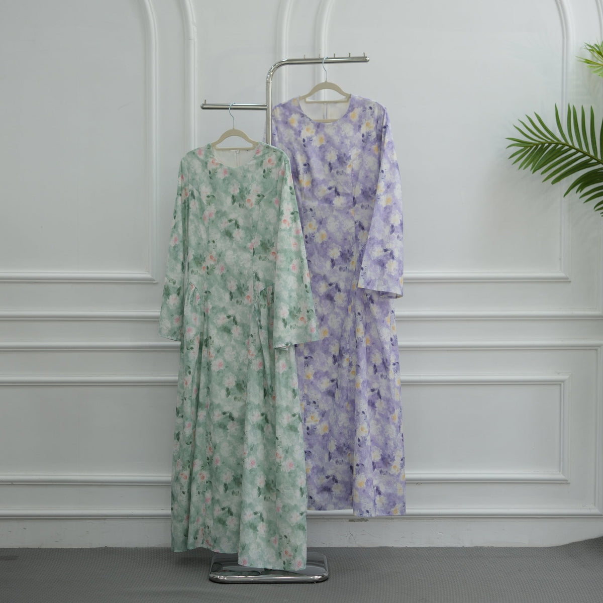 Sweeping bell sleeve detail on watercolour floral maxi dress