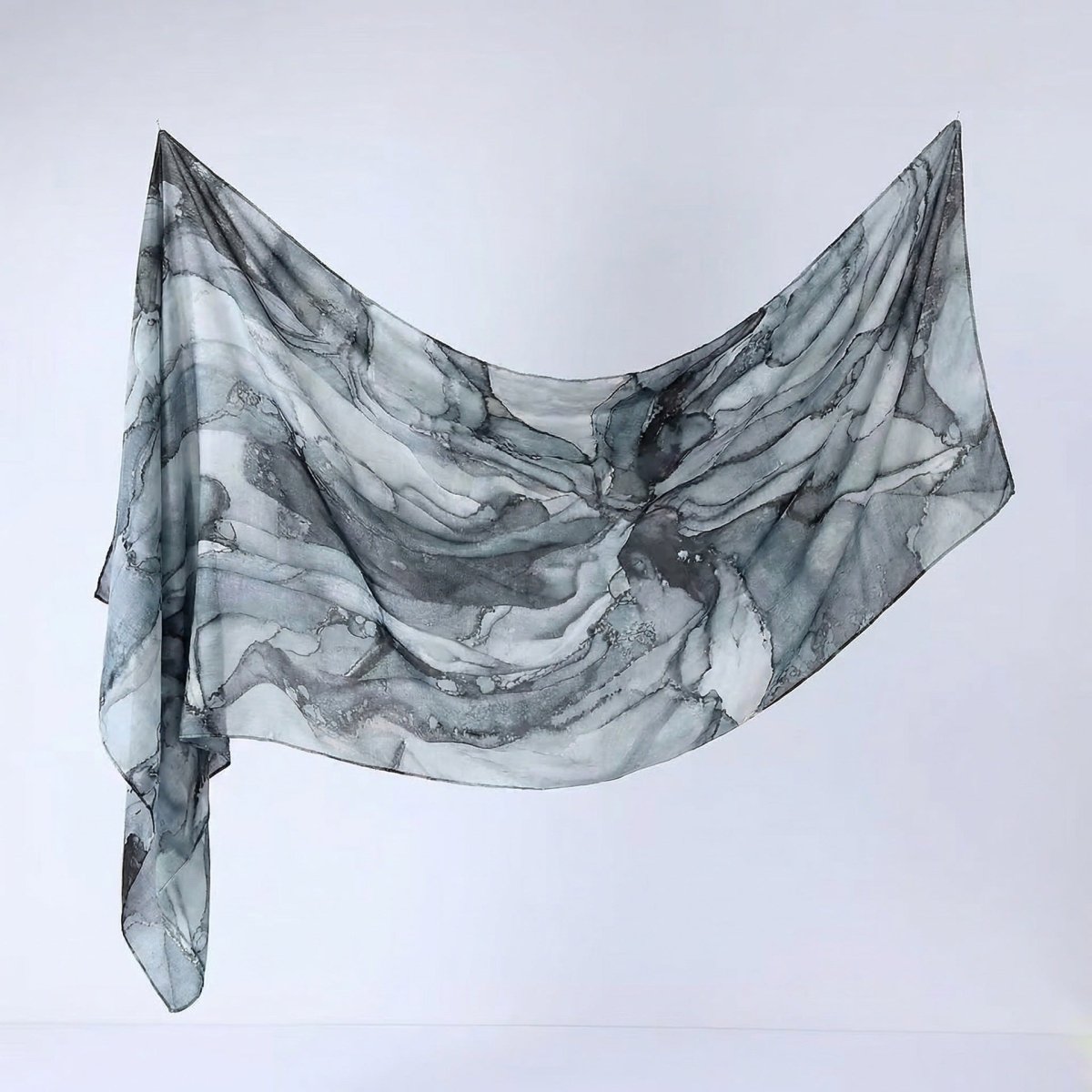 Fluid drape of printed hijab shawl showing movement and texture