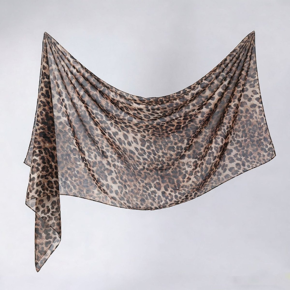 Printed hijab shawl in navy botanical print, pinned hijab style