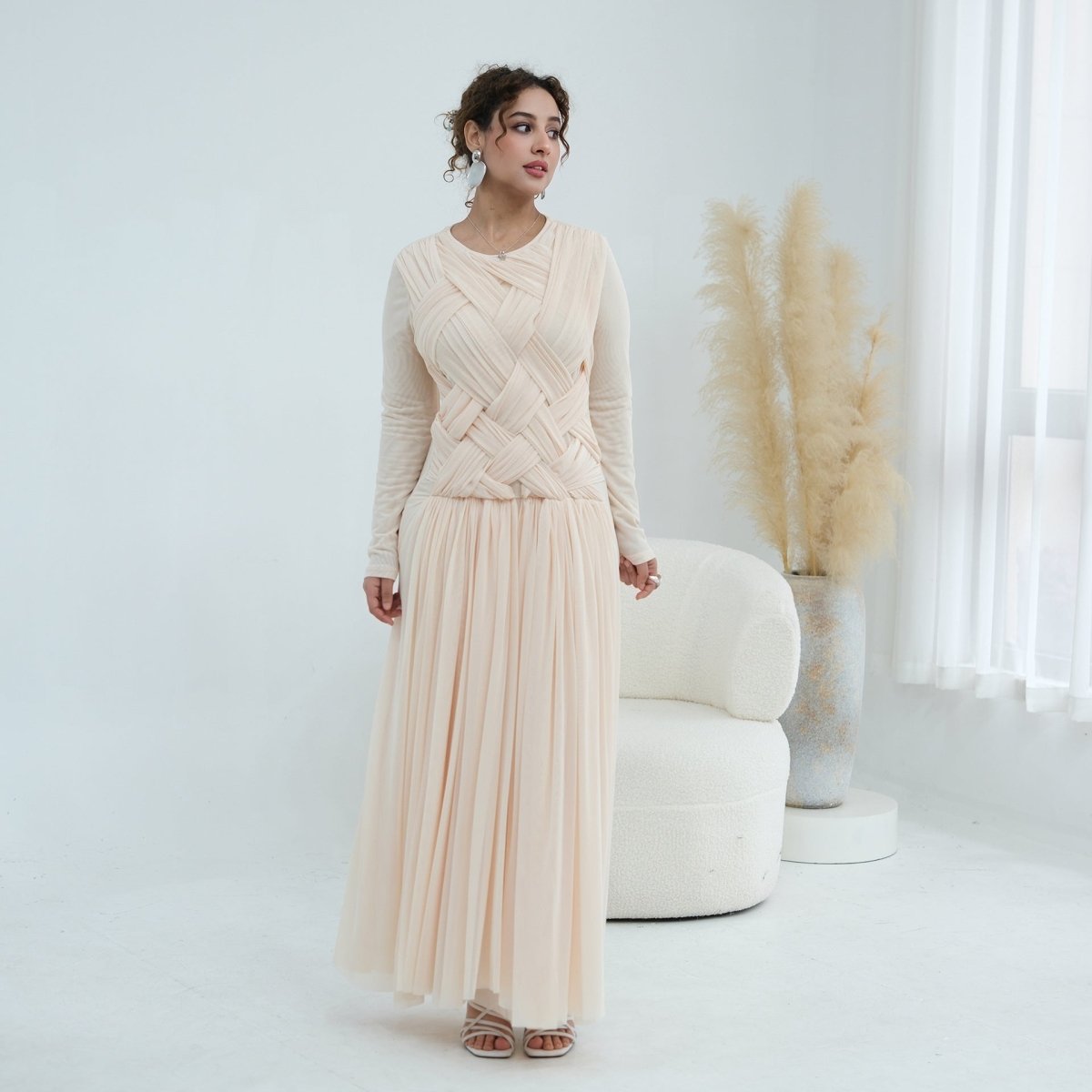 Softly pleated mesh skirt flowing at full length on modest maxi dress